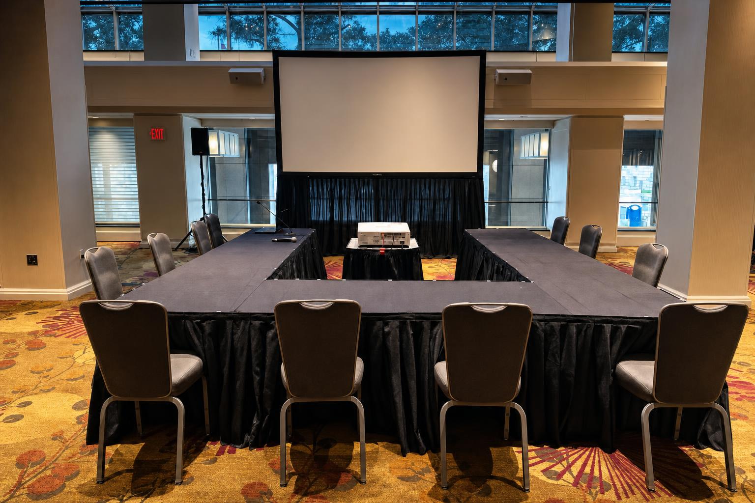 Breakout room setup with tables, AV, and pre-event production prep