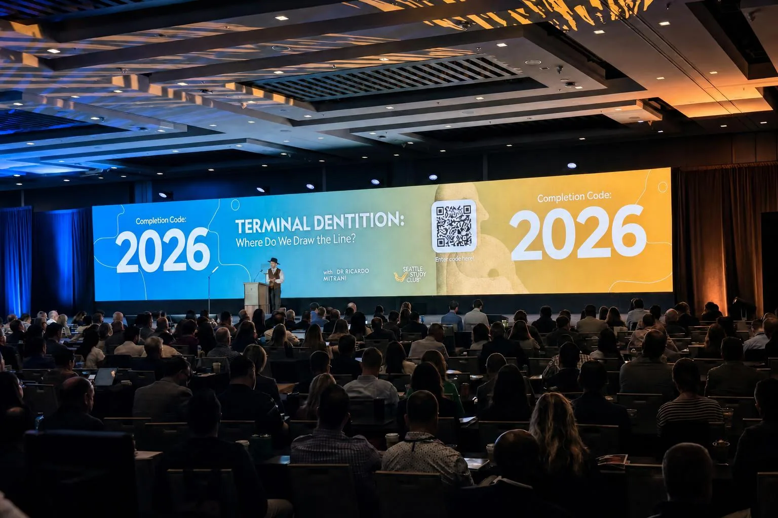 Corporate conference stage with lighting rig and seated audience